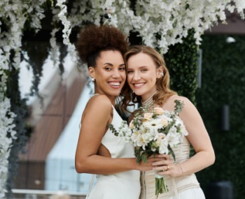 brides smile after their wedding ceremony