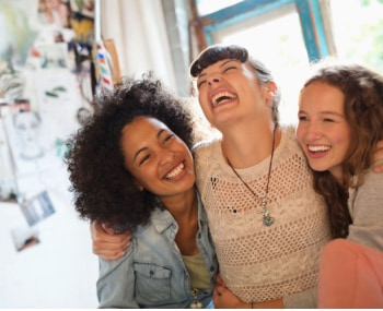 friends laugh during a trip